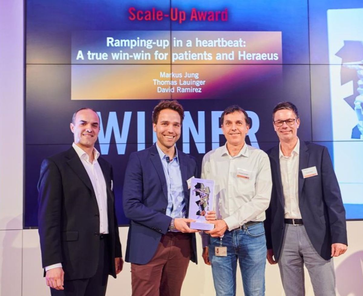 Team members with award